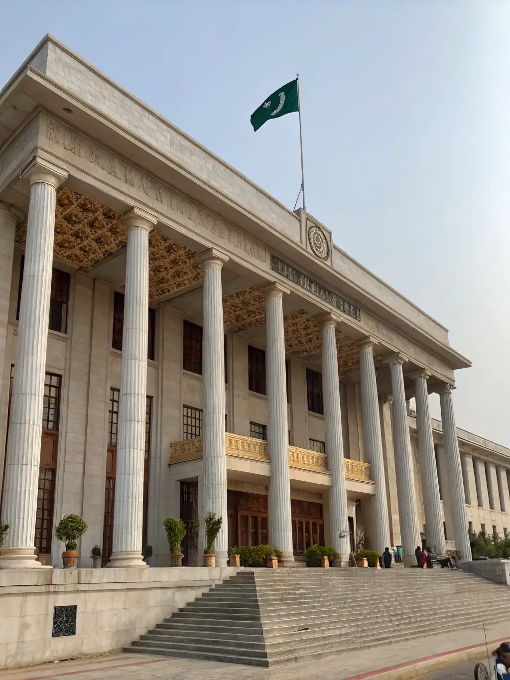 A government building with a flag waving in front, representing Planvist Projects Inc.'s experience in managing projects for the public sector.