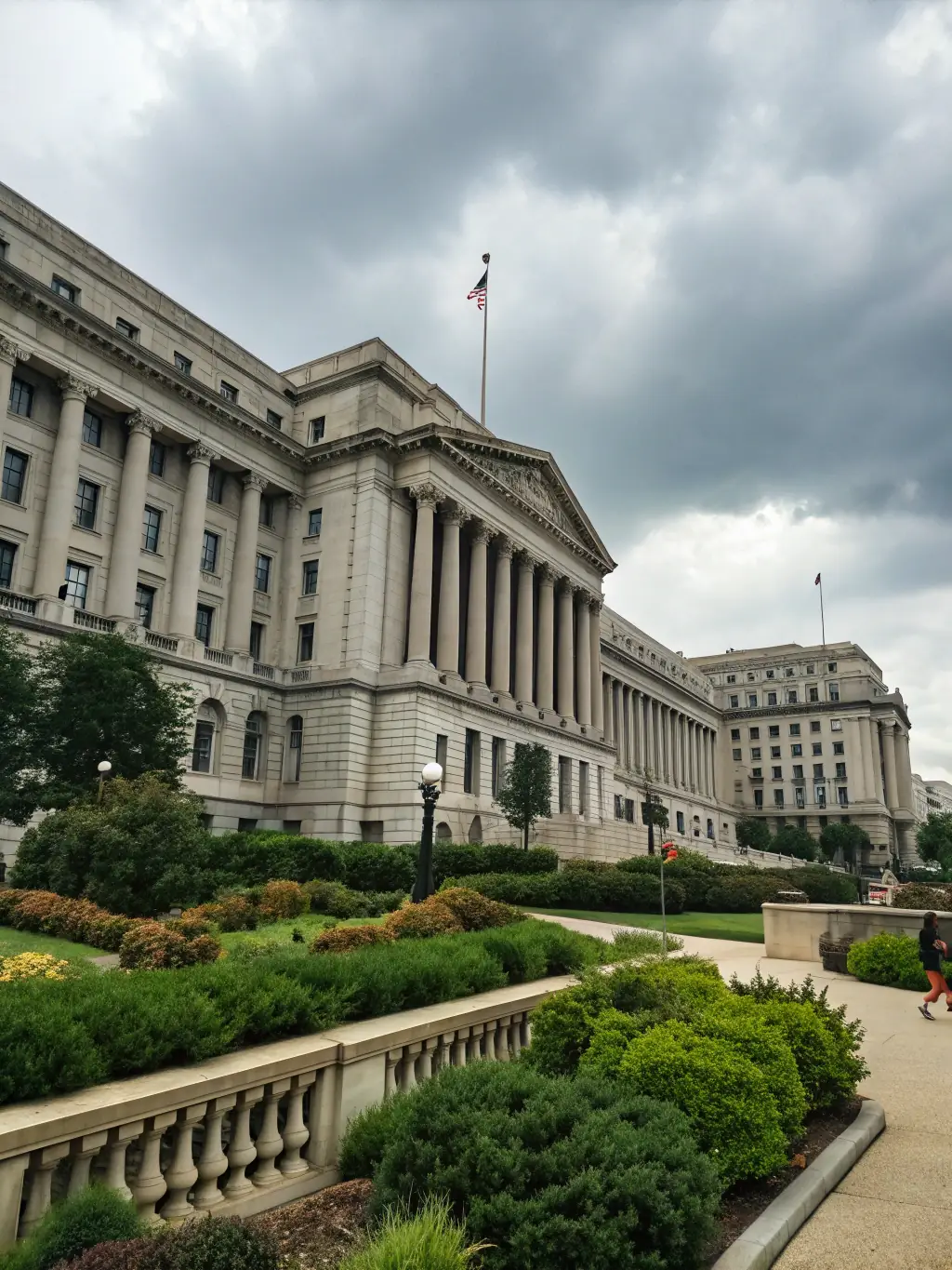 A modern government building with a well-maintained landscape, representing the public sector. The image should convey efficiency, transparency, and public service.